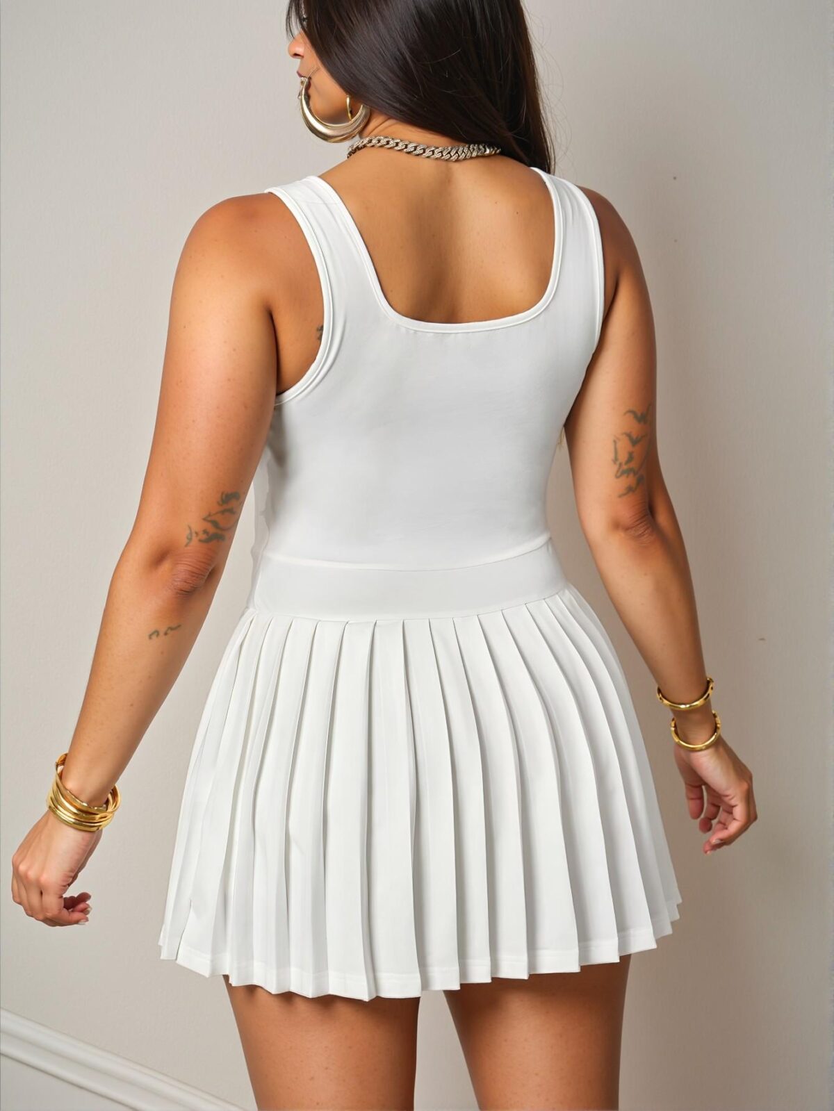 Elegant White Casual Pleated Mini Dress with Racer Vest and Black Label – Chic, Classy, and Trendy Fashion Style to Dress to Impress. - Image 2